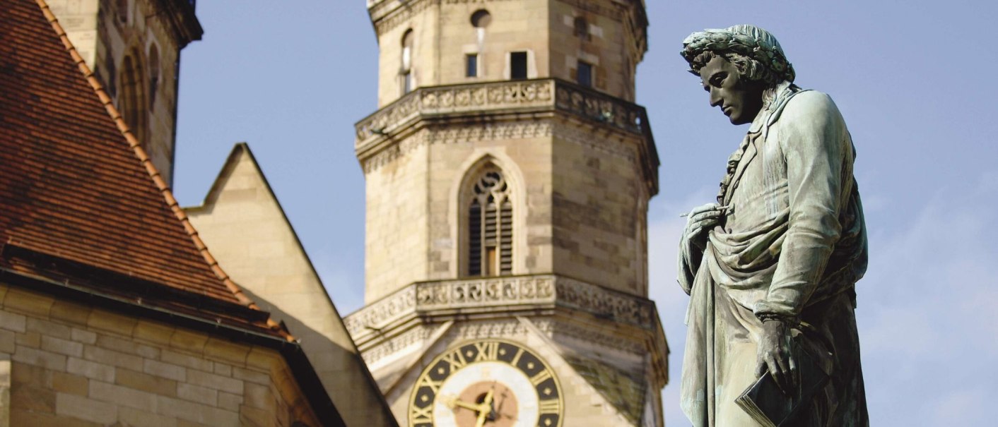 Bronze statue of Friedrich Schiller on Schillerplatz in Stuttgart, with the collegiate church in the background., &copy; Stuttgart-Marketing GmbH