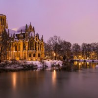 St. John's Church on the Feuersee in a wintry evening atmosphere, surrounded by snow and illuminated water., © Werner Dietrich St. John's Church on the Feuersee in a wintry evening atmosphere, surrounded by snow and illuminated water., © Werner Dietrich