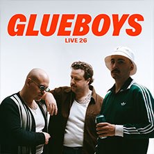 Three men stand next to each other under the lettering 'GLUEBOYS'. One is wearing sunglasses, another a hat., &copy; see on the left