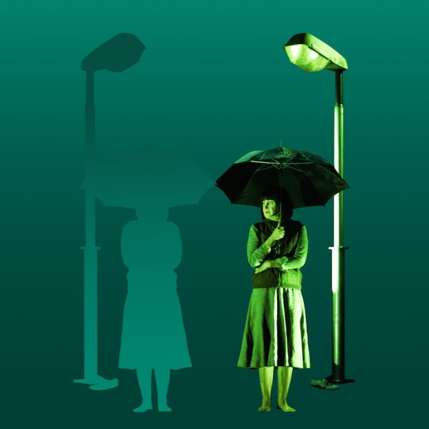 A person with an umbrella standing under a streetlight, with a silhouette next to them. Green background; the image addresses the climate crisis., &copy; Theater der Altstadt