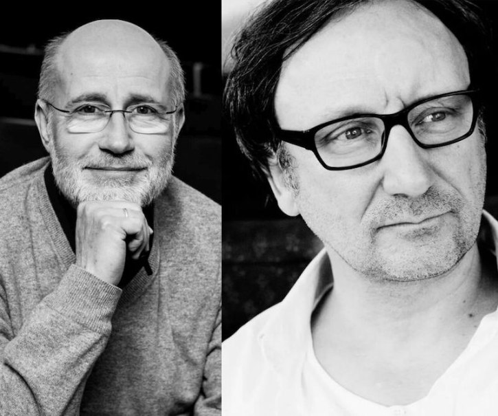 Two men in black and white portraits, one with glasses and a beard, the other with glasses and a slight shadow of a beard. Both look thoughtful., &copy; Renitenztheater Stuttgart e.V.