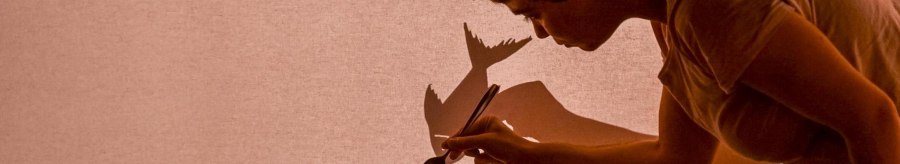 Person stirs in a cup, projects shadows onto a screen. Creative play with light and shadow., &copy; FITZ! Stuttgart