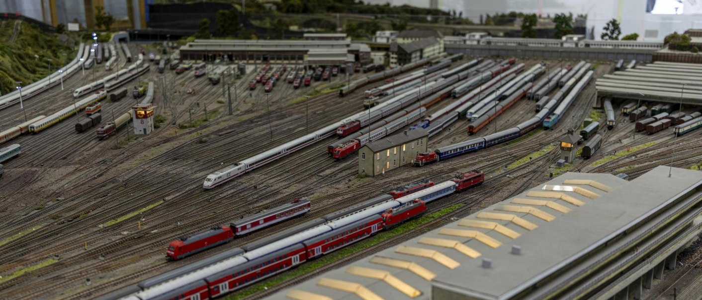 Miniature railroad layout with numerous trains and tracks in a model landscape representing Stuttgart., © Stuttgart-Marketing GmbH, Sarah Schmid Miniature railroad layout with numerous trains and tracks in a model landscape representing Stuttgart., © Stuttgart-Marketing GmbH, Sarah Schmid