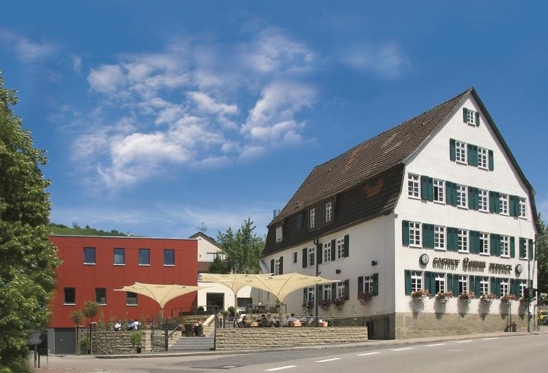 Traditional inn with modern extension and terrace, blue sky in the background. Hotel Lamm Hebsack in Remshalden-Hebsack., © TOMAS