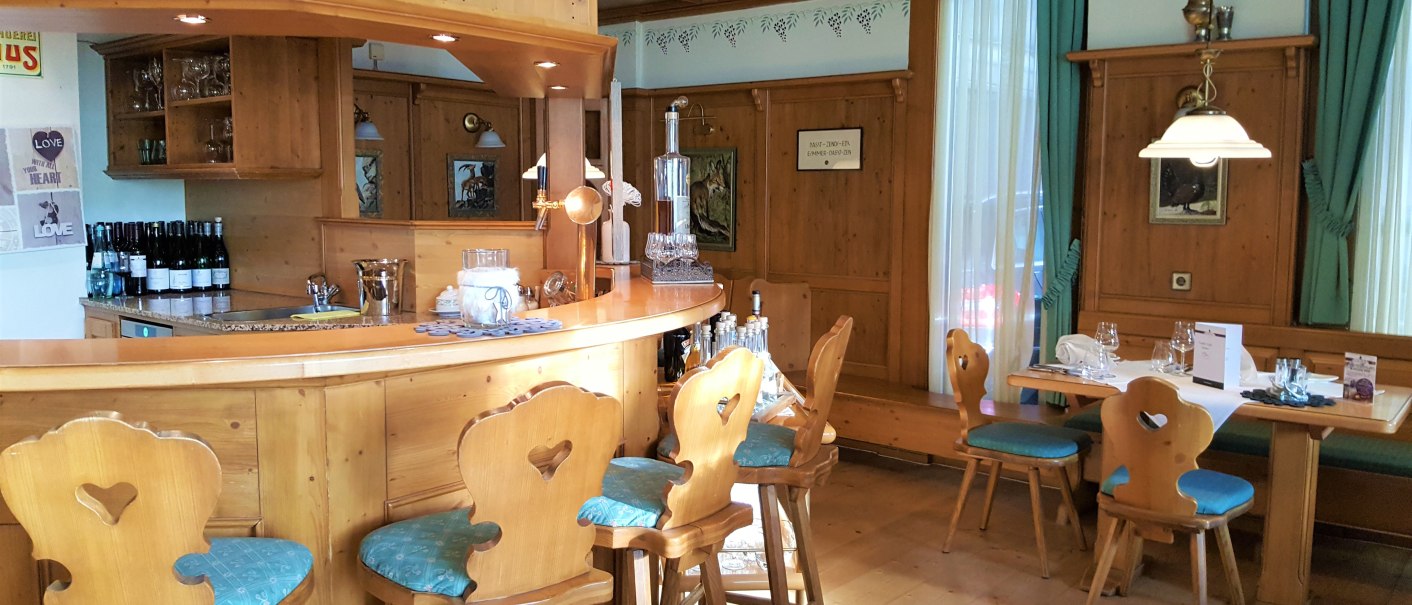 Rustic restaurant with wooden furniture, bar and laid table. Cozy atmosphere with traditional decorations., &copy; Erikson Hotel