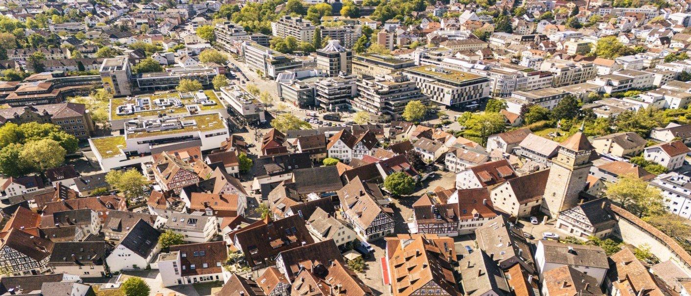 Aerial view of Waiblingen's old town with half-timbered houses, modern buildings and green trees., © SMG Stuttgart Marketing GmbH - Sarah Schmid