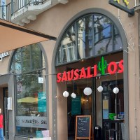 Entrance to the Sausalitos restaurant with red lettering and cactus decoration. Outdoor area with wooden tables and advertising board for Taco Tuesday., © SMG Entrance to the Sausalitos restaurant with red lettering and cactus decoration. Outdoor area with wooden tables and advertising board for Taco Tuesday., © SMG