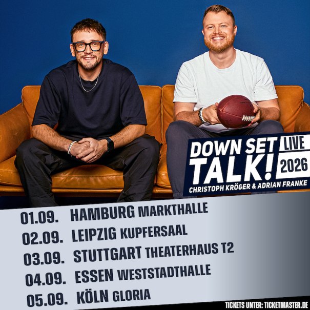 Two men sitting on a sofa, one holding a football. Text: Down Set Talk! Live 2026, tour dates in various German cities., &copy; Theaterhaus Stuttgart e.V.