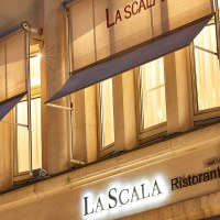 Illuminated fa&ccedil;ade of the La Scala restaurant in Stuttgart with awnings and decorative columns at night., &copy; La Scala