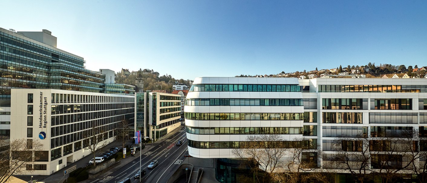 Modern office building in Stuttgart under a clear sky. The architecture is contemporary, with large glass surfaces and geometric shapes., &copy; Aloft Stuttgart