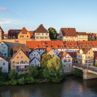 A panoramic view of the picturesque old town of Besigheim with its red roofs and the Enz River in the foreground, bathed in the evening sun., &copy; &copy; Stuttgart-Marketing GmbH