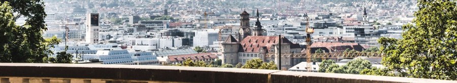 View of Stuttgart from Eugensplatz, with historic buildings and green hills in the background. A railing in the foreground., &copy; Stuttgart-Marketing GmbH Romeo Felsenreich, sommertage.com