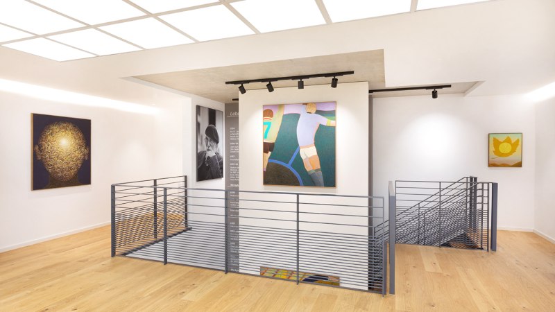 A modern gallery with wooden floors, paintings on white walls, and a central stair railing. Bright lighting and a minimalist design., © Freundeskreis Fritz Genkinger e.V. A modern gallery with wooden floors, paintings on white walls, and a central stair railing. Bright lighting and a minimalist design., © Freundeskreis Fritz Genkinger e.V.