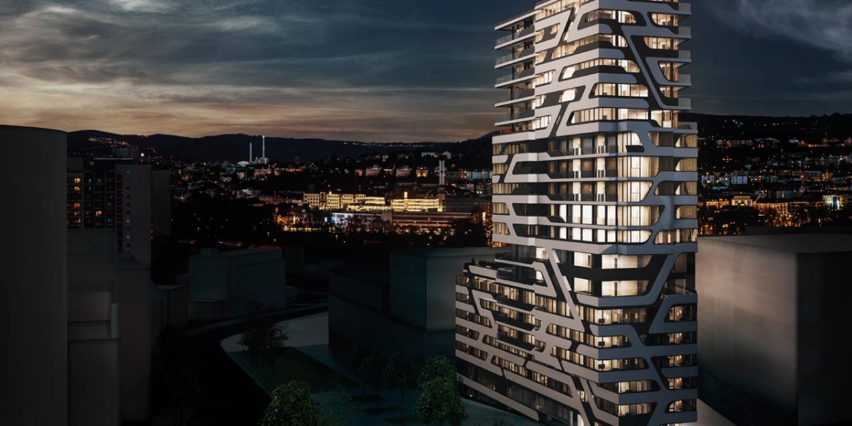A modern high-rise building with a unique design at night, illuminated, with a cityscape in the background., &copy; Jaz Hotel Stuttgart