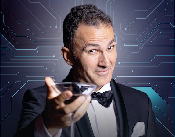 A man in a tuxedo holds a cocktail glass in front of a background with a circuit pattern. He smiles and looks charming., &copy; Rosenau Kultur e.V.