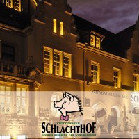 The Stuttgarter Schlachthof restaurant is illuminated at night. The façade features a pig museum and a café., © Wilhelmer Gastronomiebetriebe GmbH The Stuttgarter Schlachthof restaurant is illuminated at night. The façade features a pig museum and a café., © Wilhelmer Gastronomiebetriebe GmbH
