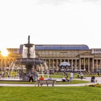 Schlossplatz in Stuttgart at sunset, people relaxing on the lawn, the K&ouml;nigsbau and a fountain in the background., &copy; Stuttgart-Marketing GmbH, Werner Dieterich