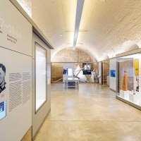 Interior view of the Stauffenberg memorial with modern exhibits, information boards and screens in a vaulted room., © Daniel Stauch Photography Interior view of the Stauffenberg memorial with modern exhibits, information boards and screens in a vaulted room., © Daniel Stauch Photography