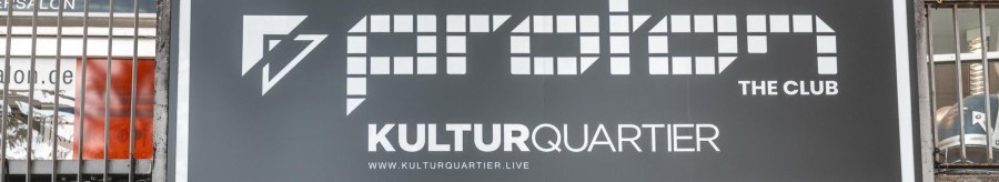 Sign for Proton The Club in the Kulturquartier with website address. Lighting and metal structure visible underneath., © Stuttgart Marketing GmbH, Sarah Schmid