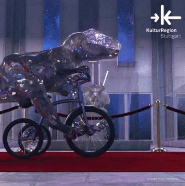 Ein glitzernder Dinosaurier fährt auf einem Fahrrad über einen roten Teppich. Im Hintergrund ist ein modernes Gebäude zu sehen. Logo: KulturRegion Stuttgart., © Adobe Stock, flashmovie