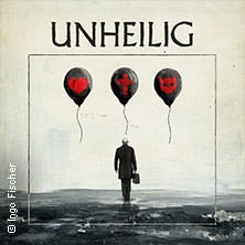 A man with a briefcase walks towards three black balloons bearing symbols for love, faith and monsters. At the top it says 'Unheilig'., © links im Bild A man with a briefcase walks towards three black balloons bearing symbols for love, faith and monsters. At the top it says 'Unheilig'., © links im Bild