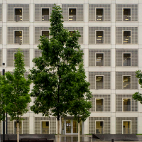 The city library on Mailänder Platz has a modern, square façade with symmetrical windows. There are several trees in front of the building., © Stuttgart-Marketing GmbH, Frank Hörner The city library on Mailänder Platz has a modern, square façade with symmetrical windows. There are several trees in front of the building., © Stuttgart-Marketing GmbH, Frank Hörner