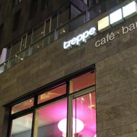 Modern building with the inscription 'treppe caf&eacute; - bar' and illuminated windows at night., &copy; Caf&eacute; Treppe, Stuttgart