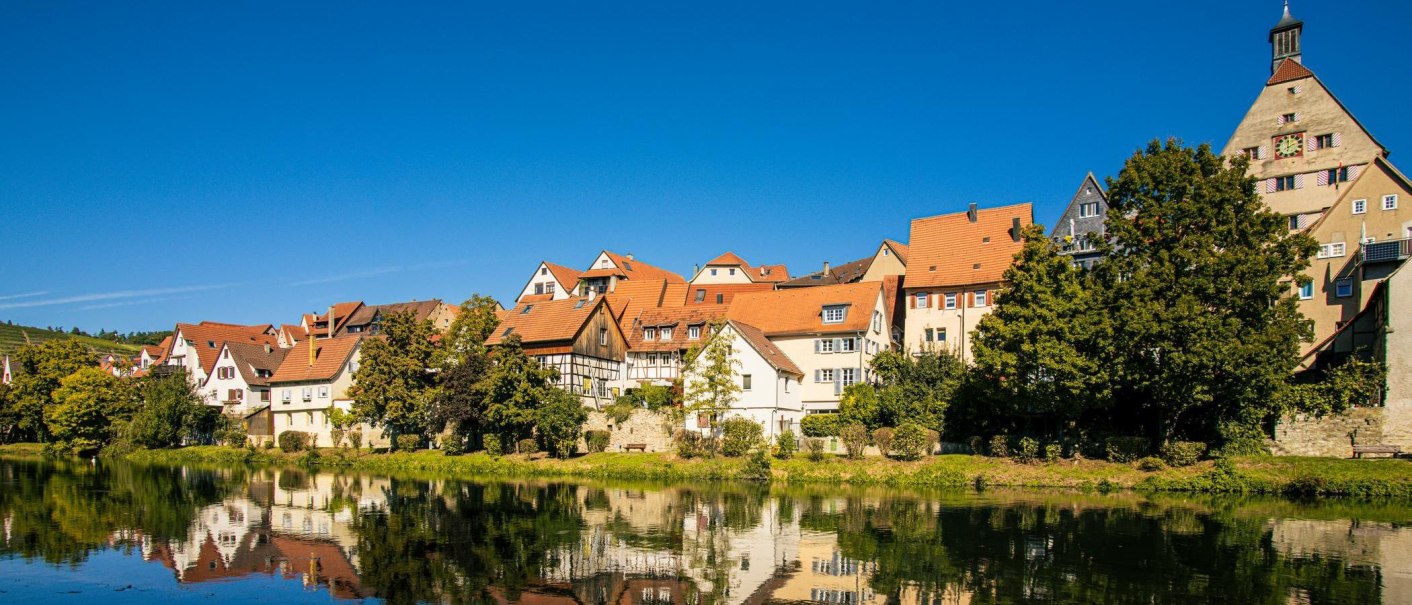 Besigheim: Picturesque half-timbered houses are reflected in the calm river under a clear blue sky., © Stuttgart-Marketing GmbH, Sarah Schmid