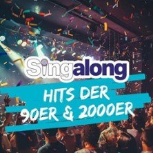 A lively concert scene with confetti and lighting effects, promoting the sing-along event 'Singalong - Hits of the 90s & 2000s'., © links im Bild A lively concert scene with confetti and lighting effects, promoting the sing-along event 'Singalong - Hits of the 90s & 2000s'., © links im Bild