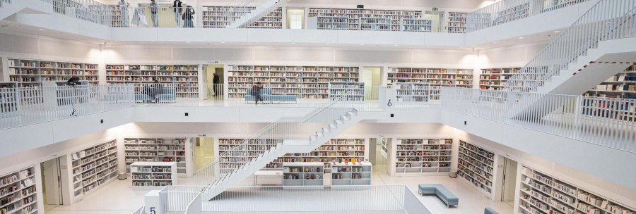 Interior view of Stuttgart City Library with several floors, white walls and shelves full of books. People move around the floors., © Stuttgart-Marketing GmbH, Sarah Schmid Interior view of Stuttgart City Library with several floors, white walls and shelves full of books. People move around the floors., © Stuttgart-Marketing GmbH, Sarah Schmid