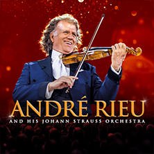 Andr&eacute; Rieu spielt Geige vor einem roten Hintergrund. Der Text "Andr&eacute; Rieu and his Johann Strauss Orchestra" ist zu sehen., &copy; links im Bild