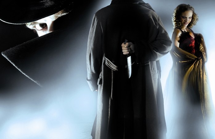 Ein Mann im Mantel und Hut hält ein Messer, während eine Frau in einem roten Kleid daneben steht. Die Szene ist von Nebel umgeben., © Gruseldinner GmbH & Co. KG Ein Mann im Mantel und Hut hält ein Messer, während eine Frau in einem roten Kleid daneben steht. Die Szene ist von Nebel umgeben., © Gruseldinner GmbH & Co. KG