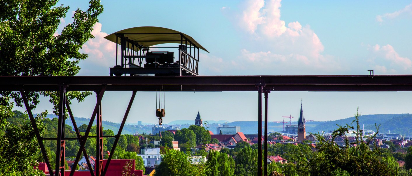 Old cable car in the travertine park, in the foreground trees and meadow, in the background city view with church towers and hills., © Stuttgart-Marketing GmbH Old cable car in the travertine park, in the foreground trees and meadow, in the background city view with church towers and hills., © Stuttgart-Marketing GmbH