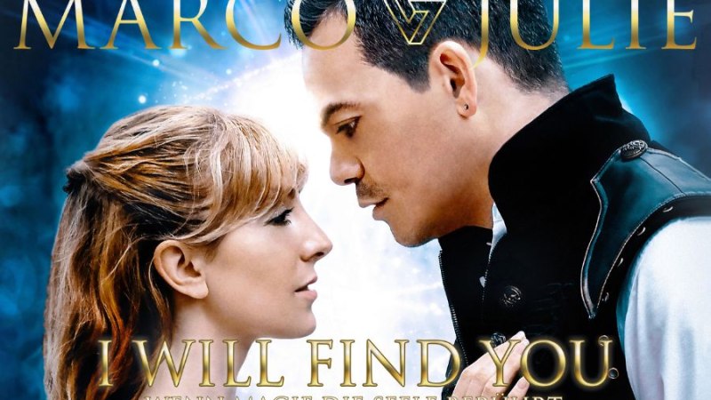 Ein Paar steht sich nah gegenüber, umgeben von magischem Licht. Der Titel 'Marco & Julie' ist oben zu sehen., © Friedrichsbau Varieté Ein Paar steht sich nah gegenüber, umgeben von magischem Licht. Der Titel 'Marco & Julie' ist oben zu sehen., © Friedrichsbau Varieté