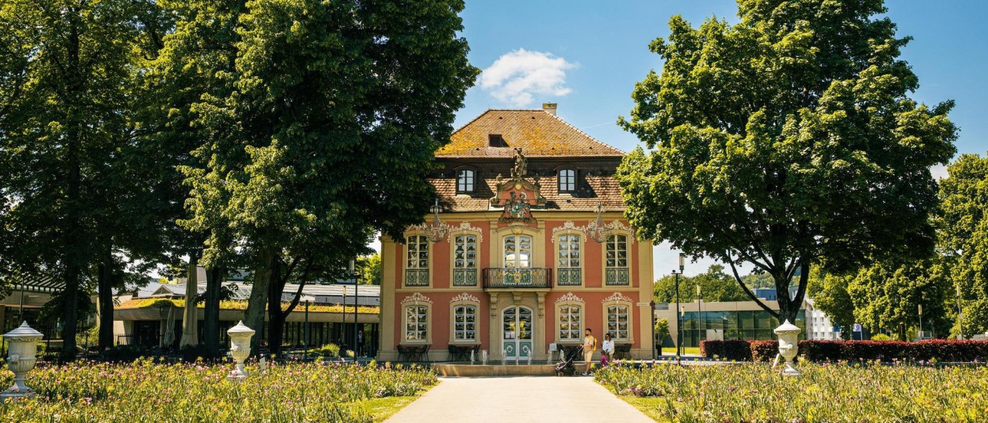 The Rococo mansion in Schw&auml;bisch Gm&uuml;nd, surrounded by blooming gardens and tall trees, on a sunny day., &copy; SMG Stuttgart Marketing GmbH - Sarah Schmid