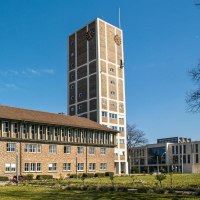 The Kornwestheim City Hall, with its tower and modern addition, surrounded by trees and a meadow under a blue sky., &copy; SMG Stuttgart Marketing GmbH - Sarah Schmid