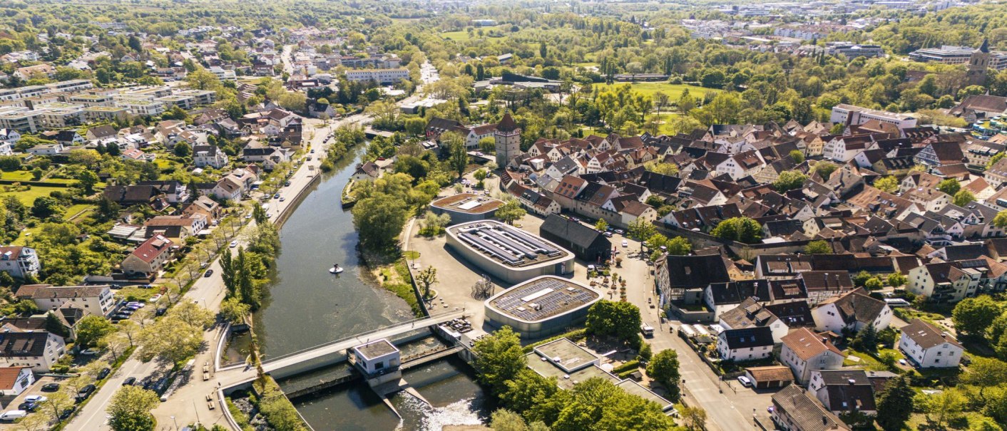 Aerial view of the old town of Waiblingen with densely packed houses, a river and lots of greenery. Modern buildings and streets are also visible., © SMG Stuttgart Marketing GmbH - Sarah Schmid Aerial view of the old town of Waiblingen with densely packed houses, a river and lots of greenery. Modern buildings and streets are also visible., © SMG Stuttgart Marketing GmbH - Sarah Schmid