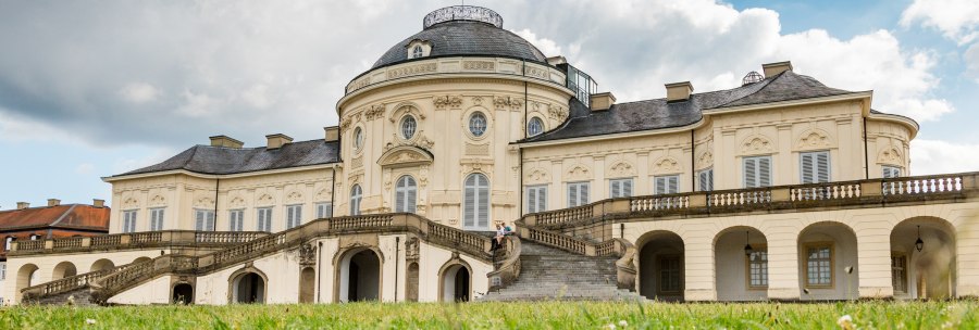 Solitude Palace with baroque architecture, staircase and green meadow in the foreground. The sky is cloudy., &copy; Kartin Lehr VIEL UNTERWEGS