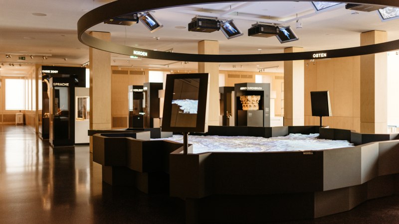 Interior view of the exhibition in the StadtPalais with interactive displays and thematic areas such as North, East and Language., &copy; Julia Sang Nguyen