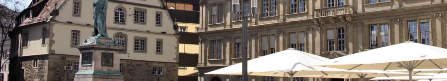 Schillerplatz in Stuttgart with a statue in the foreground, surrounded by historic buildings and people sitting under parasols., &copy; Stuttgart-Marketing GmbH