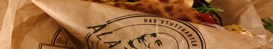 A sandwich with vegetables and cheese in an Alaturka paper bag labeled "The Stuttgart Original"., &copy; Stuttgart-Marketing GmbH