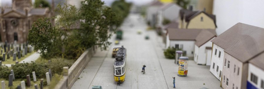 Miniature town with a streetcar, small houses and a church in the background. Detailed depiction of streets and vegetation., © Stuttgart-Marketing GmbH, Sarah Schmid