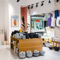Ceramics store with shelves full of crockery, cups and vases. Pictures and bags hang on the wall. You can see a street through the shop window., &copy; by Canto