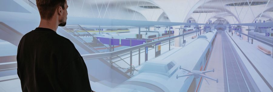 Ein Mann steht vor einer virtuellen Projektion eines futuristischen Bahnhofs mit Zügen und Bahnsteigen., © Thomas Niedermüller