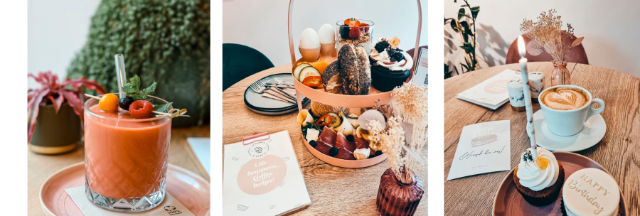A smoothie with berries, a breakfast tray with bagels and cupcakes, and a cappuccino with a birthday cupcake on a table., &copy; Cupcakes & Bagels, Stuttgart