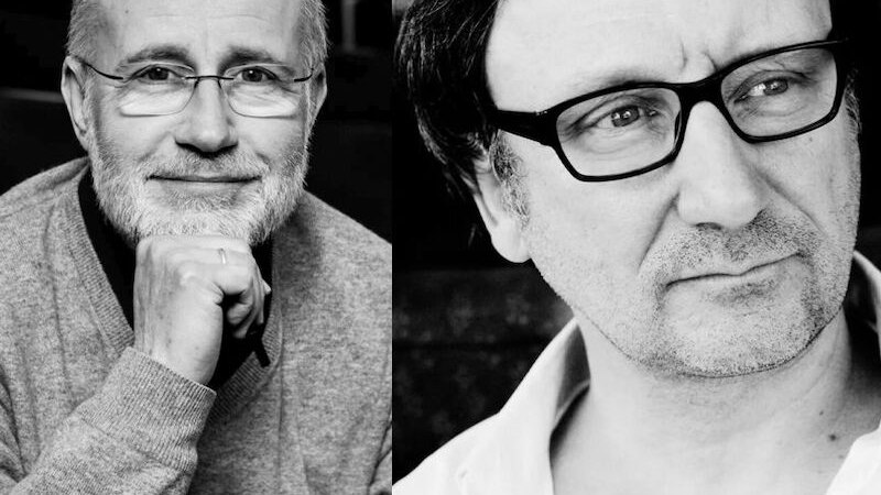 Two men in black and white portraits, one with glasses and a beard, the other with glasses and a slight shadow of a beard. Both look thoughtful., &copy; Renitenztheater Stuttgart e.V.