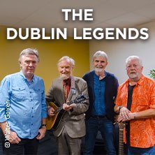 Vier M&auml;nner posieren zusammen, einer h&auml;lt ein Musikinstrument. &Uuml;ber ihnen steht 'The Dublin Legends'., &copy; links im Bild