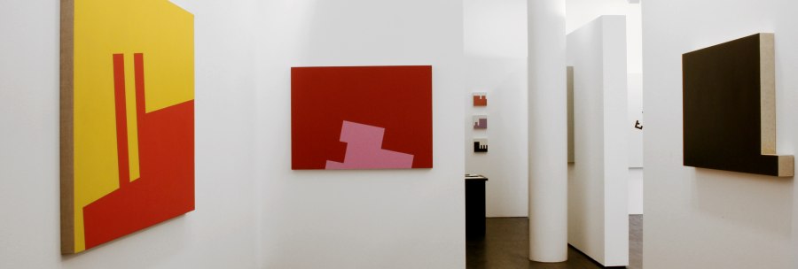 Modern art gallery with abstract paintings in bold colors on white walls, dark wooden floor, minimalist design., &copy; Galerie Klaus Braun