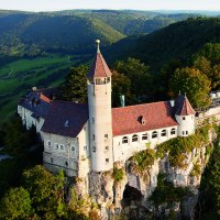 Teck Castle stands majestically atop a wooded hill, surrounded by green valleys and forests in the distance., &copy; &copy; Stuttgart-Marketing GmbH