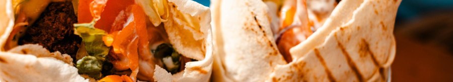 Two filled wraps with vegetables and falafel, appetizingly arranged. Close-up shows fresh ingredients and grilled bread., &copy; Stuttgart Marketing GmbH, Sarah Schmid